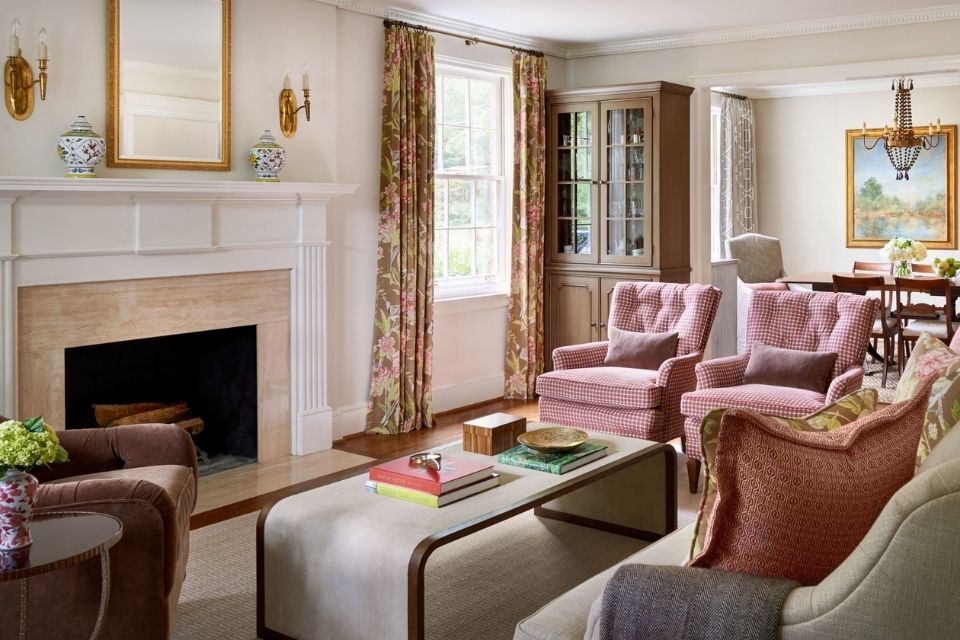 Traditional room with fireplace, mirror above fireplace and two sconces